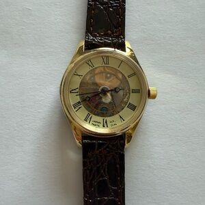 Tourneau Gold and Brown Watch; brand new never worn collector item. Delicate.